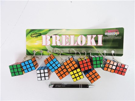 BRELOK x 12 kostka kol., plast.,            fol.